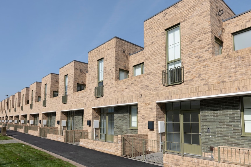 A row of new brick houses.