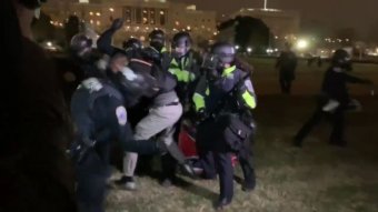 Video still shows Trump supporters clashing with police