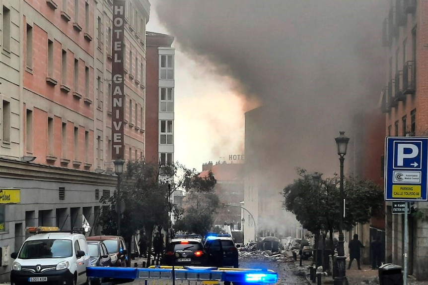 Smoke rises above buildings in Madrid, Spain.