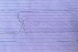 A stick figure drawing of a person cuffed to a wall