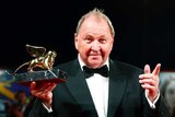 Swedish director Roy Andersson holds Golden Lion award