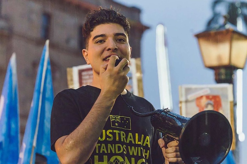 A young man with a megaphone