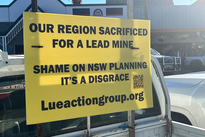 Placard attached to the back of a ute 