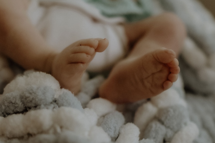 A closeup of a baby's feet.