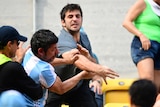 Argentina fan takes a swing at another crowd member at the Rio tennis