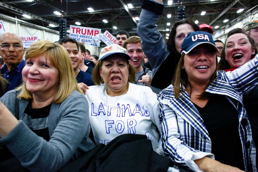 Supporters await the arrival of US Republican presidential candidate Donald Trump.