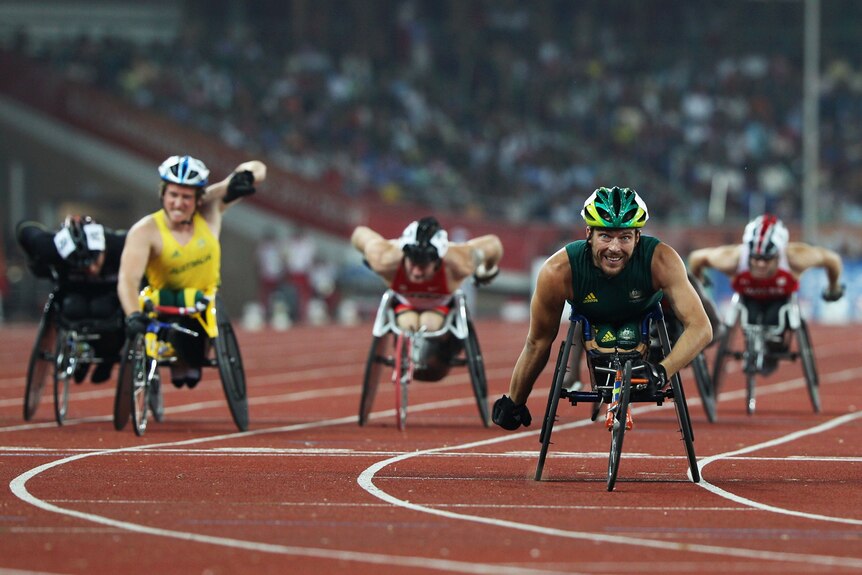 Australian wheelchair racer Kurt Fearnley wins gold in the 1500m at the Delhi Commonwealth Games.