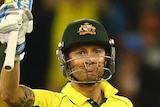 Michael Clarke of Australia celebrates after reaching his half century