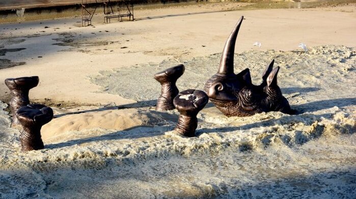 A king tide hits the 'Buried Rhino' sculpture by Gillie and Mark Schattner