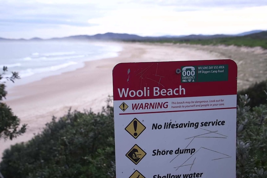 Wooli beach sign says no lifesavers