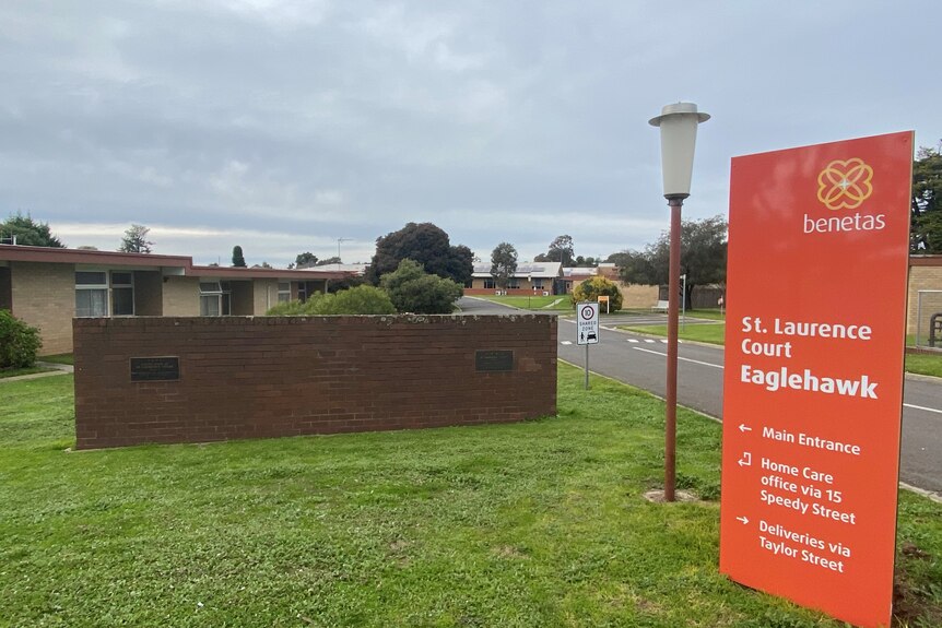A sign of the Benetas aged care home, outside houses. 