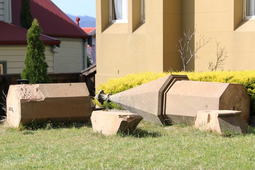 Church roof adornments pictured where they have fallen.