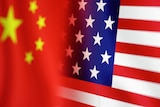 The Chinese flag sits alongside the American flag