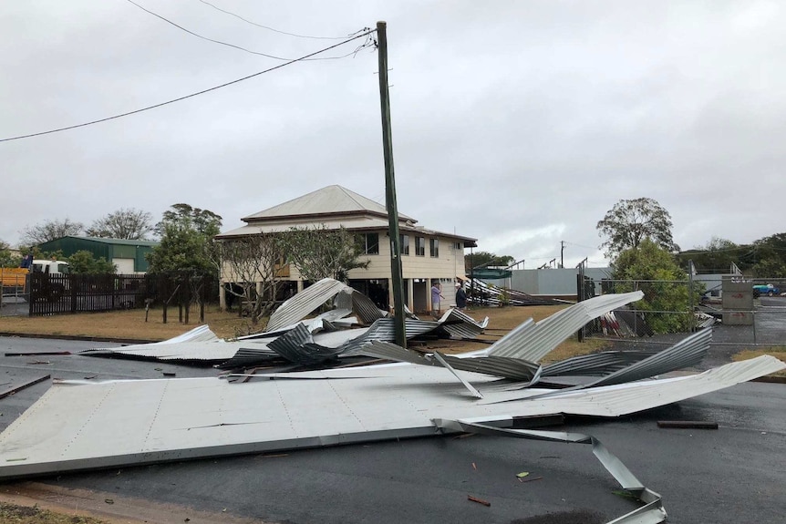 Parts of a roof strewn across a road