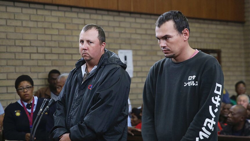 Theo Jackson, left, and Willem Oosthuizen, right, appear in the Magistrates Court in Middelburg, South Africa.