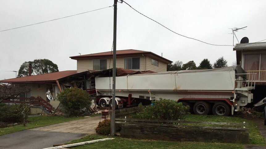 A house partly demolished by a truck in Scottsdale