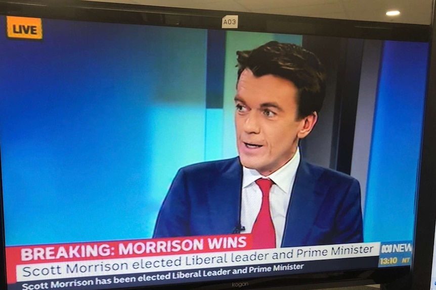 Still frame from News coverage of leadership crisis showing Rowland on air with graphic saying "Morrison wins".
