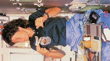 Astronauts Sally Ride (top) and Kathy Sullivan eat together on Ride's second spaceflight.