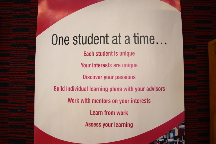 A red and white banner that reads 'One student at a time...'