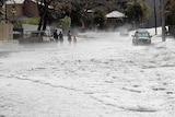 Hail covers a street in Taringa, Brisbane, after a storm that swept across the city.
