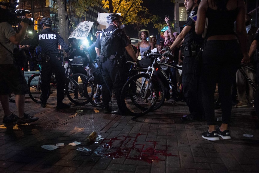 Blood is seen on the ground after a man was shot during a demonstration against police violence in Charlotte, September 21 2016.