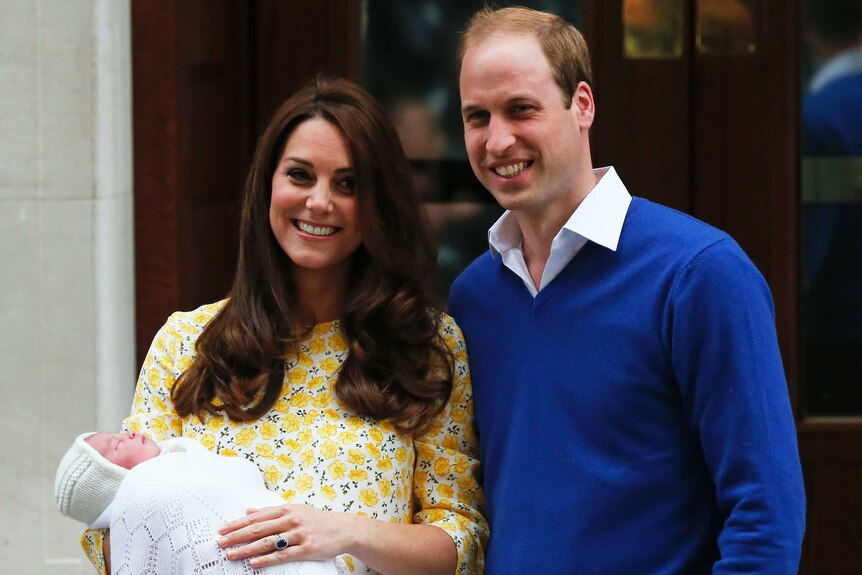 Prince William and his wife Kate appear with their baby daughter