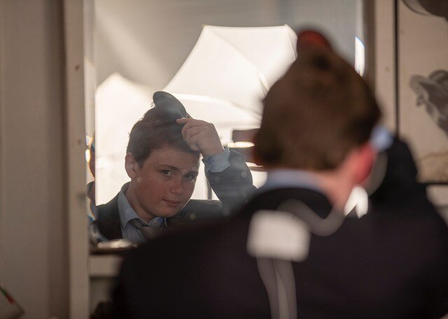 Taking his anchor man hairdo seriously before fronting the camera for 6 News.