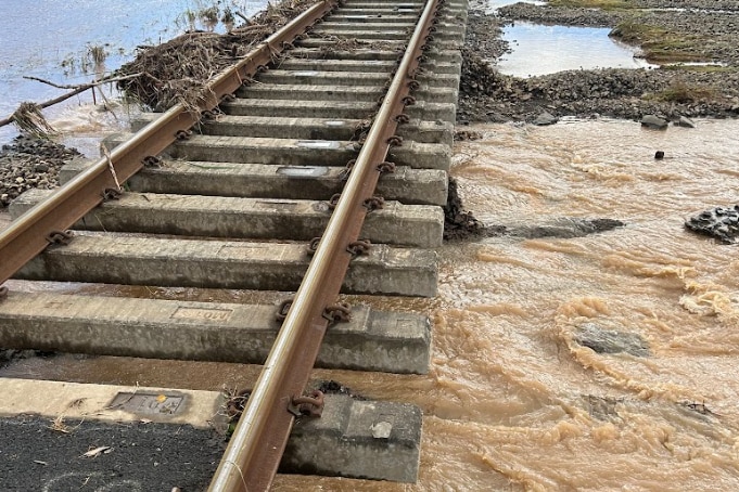 Rail tracks with sand washed out from underneath.