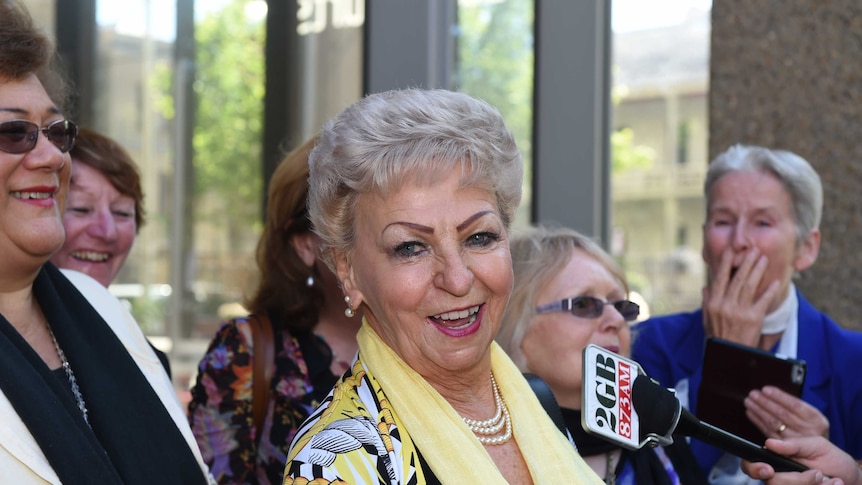 Roseanne Beckett with her supporters outside the NSW Supreme Court.