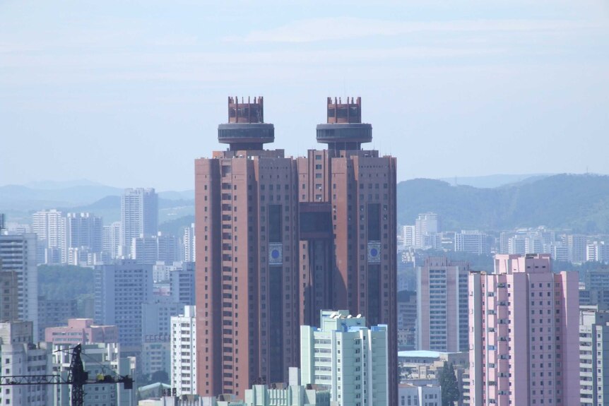 The twin towers of the Koryo Hotel among other tall buildings in Pyongyang.