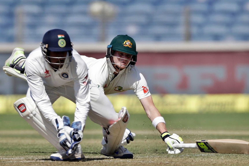 Steve Smith dives to make his crease against India
