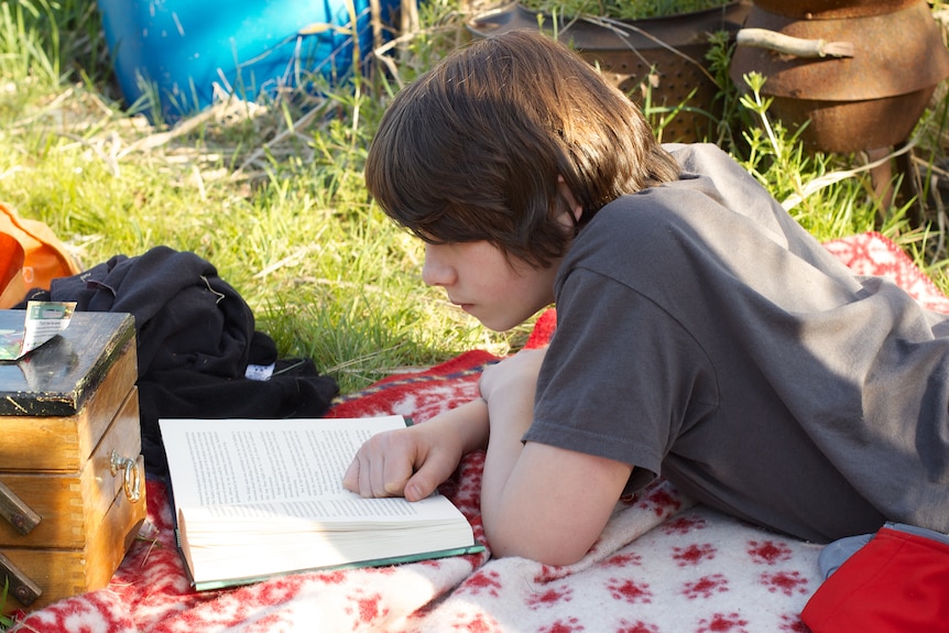 Teen boy reading