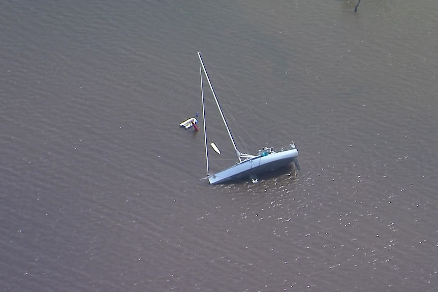 A boat is partially sunken in Gold Coast waters