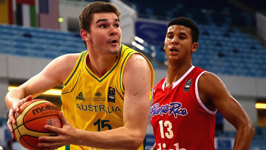 Australia's Isaac Humphries drives against Puerto Rico at 2014 FIBA world under-17 championships.