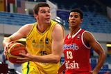 Australia's Isaac Humphries drives against Puerto Rico at 2014 FIBA world under-17 championships.