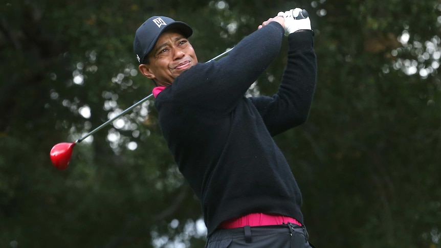 Tiger Woods hits a tee-shot on the sixth hole of his second round at the World Challenge.