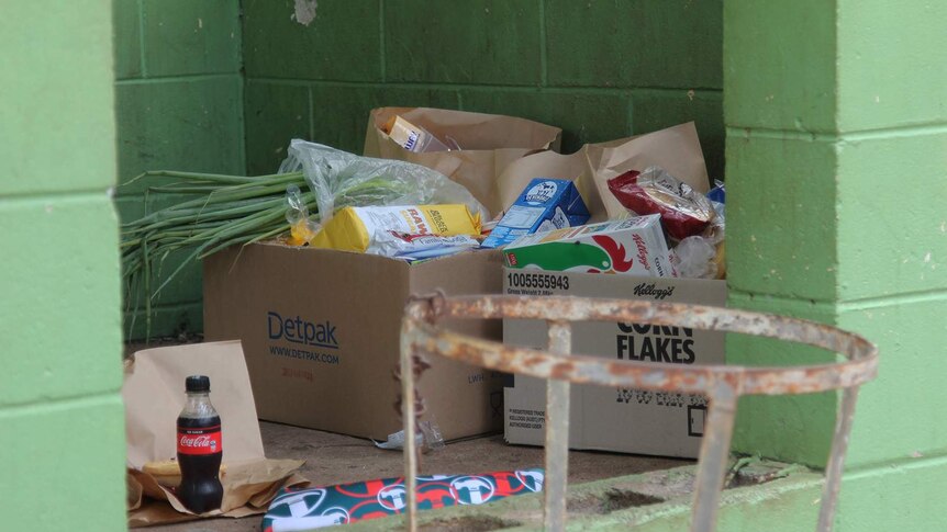 A photo of cardboard boxes filled with standard grocery items.