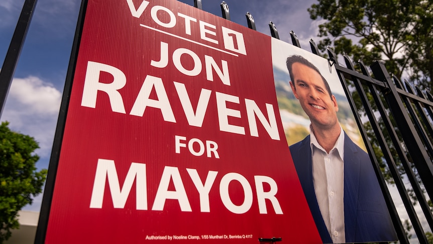 A red vote 1 for Jon Raven for mayor sign.