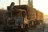 Damaged aid trucks after an air strike in western Aleppo.
