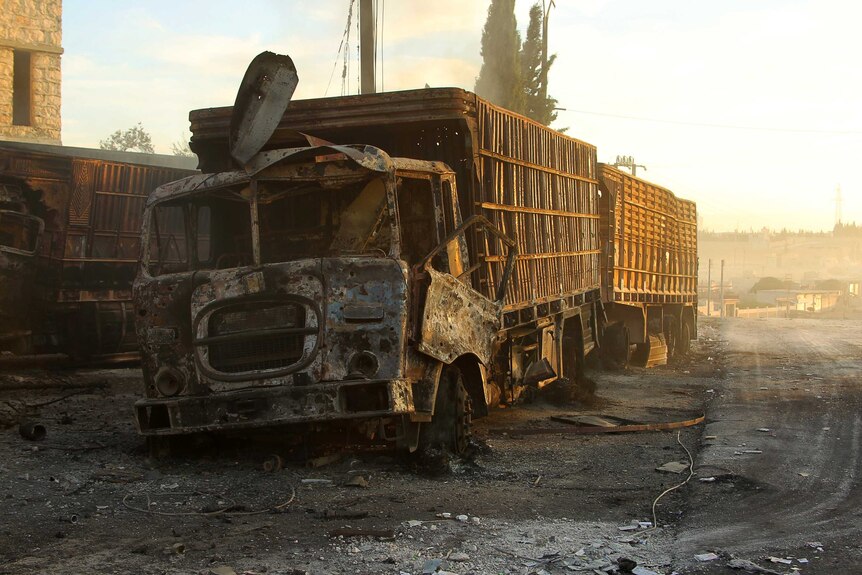 Damaged aid trucks after an air strike in western Aleppo.