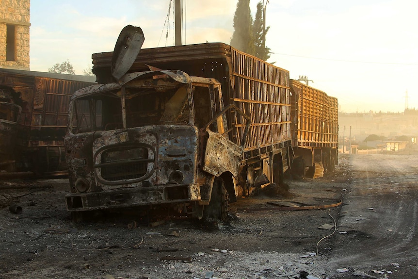 Damaged aid trucks after an air strike in western Aleppo.