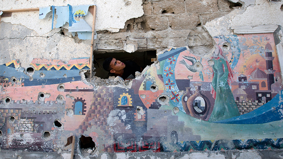 A Palestinian man inspects the damage at a UN school at the Jabalia refugee camp in northern Gaza.