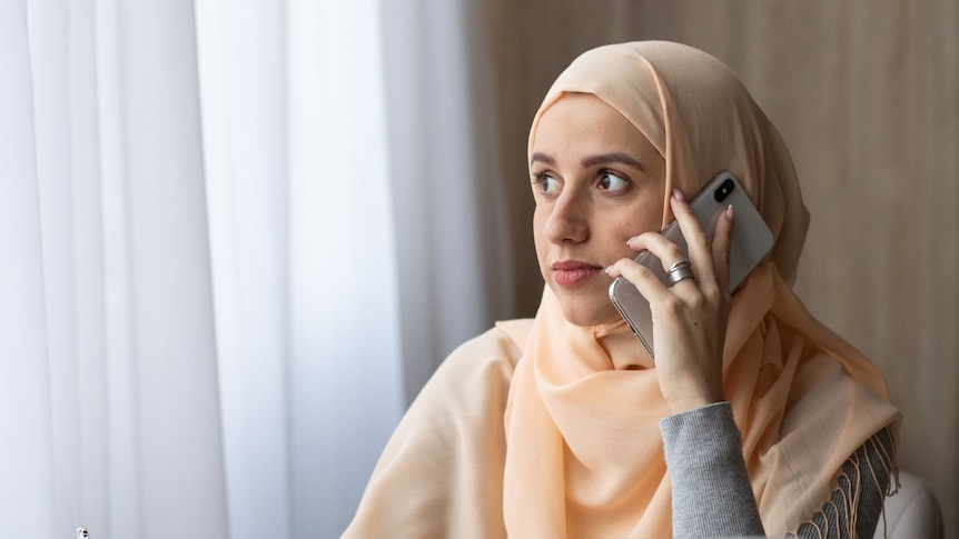 A woman talks on her mobile phone.