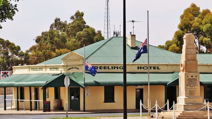 Flags fly at half mast outside the Freeling hotel
