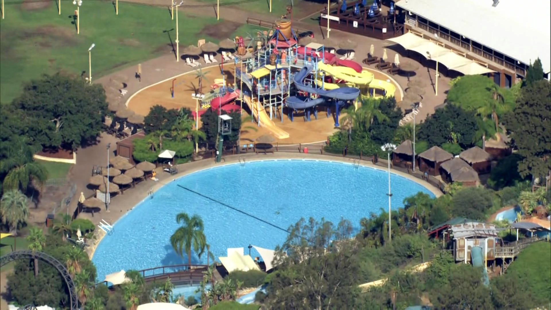 An aerial shot of a pool at a theme park