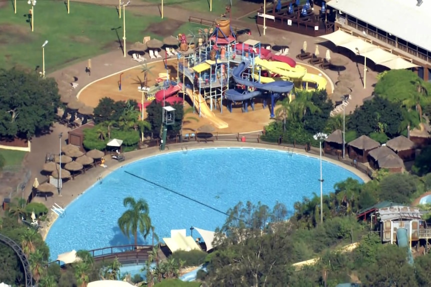 An aerial shot of a pool at a theme park
