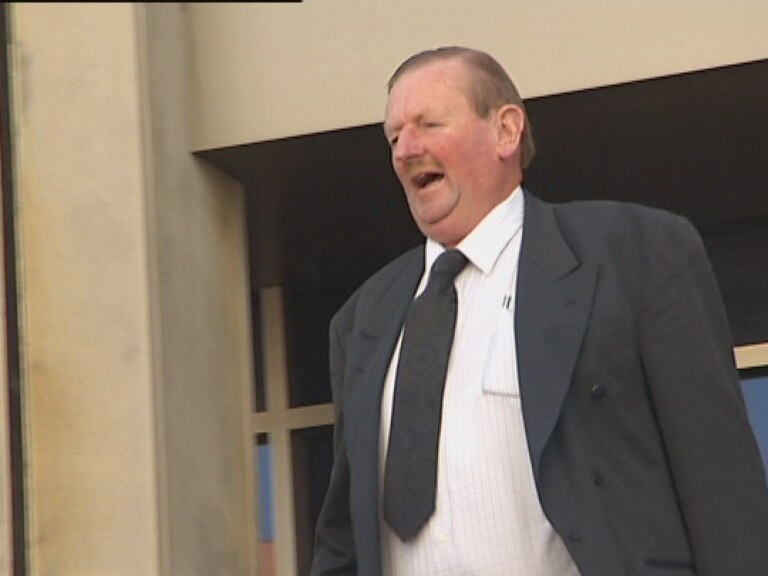 Councillor McGinniss leaves the Magistrates Court after denying he made obscene calls and contacted sex lines on the same phone.