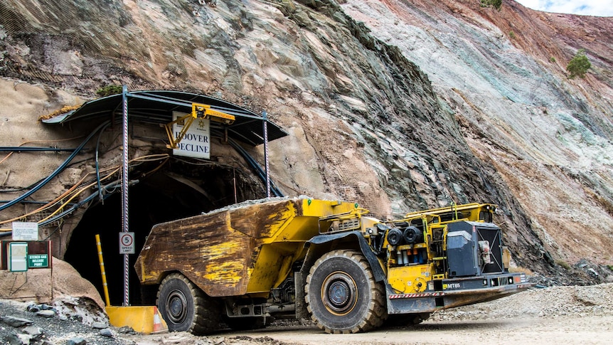 A truck emerges from underground gold mine.