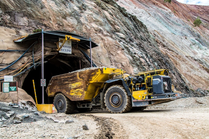 A truck emerges from underground gold mine.