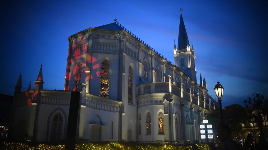 The facade of Chijmes central chapel at night time.